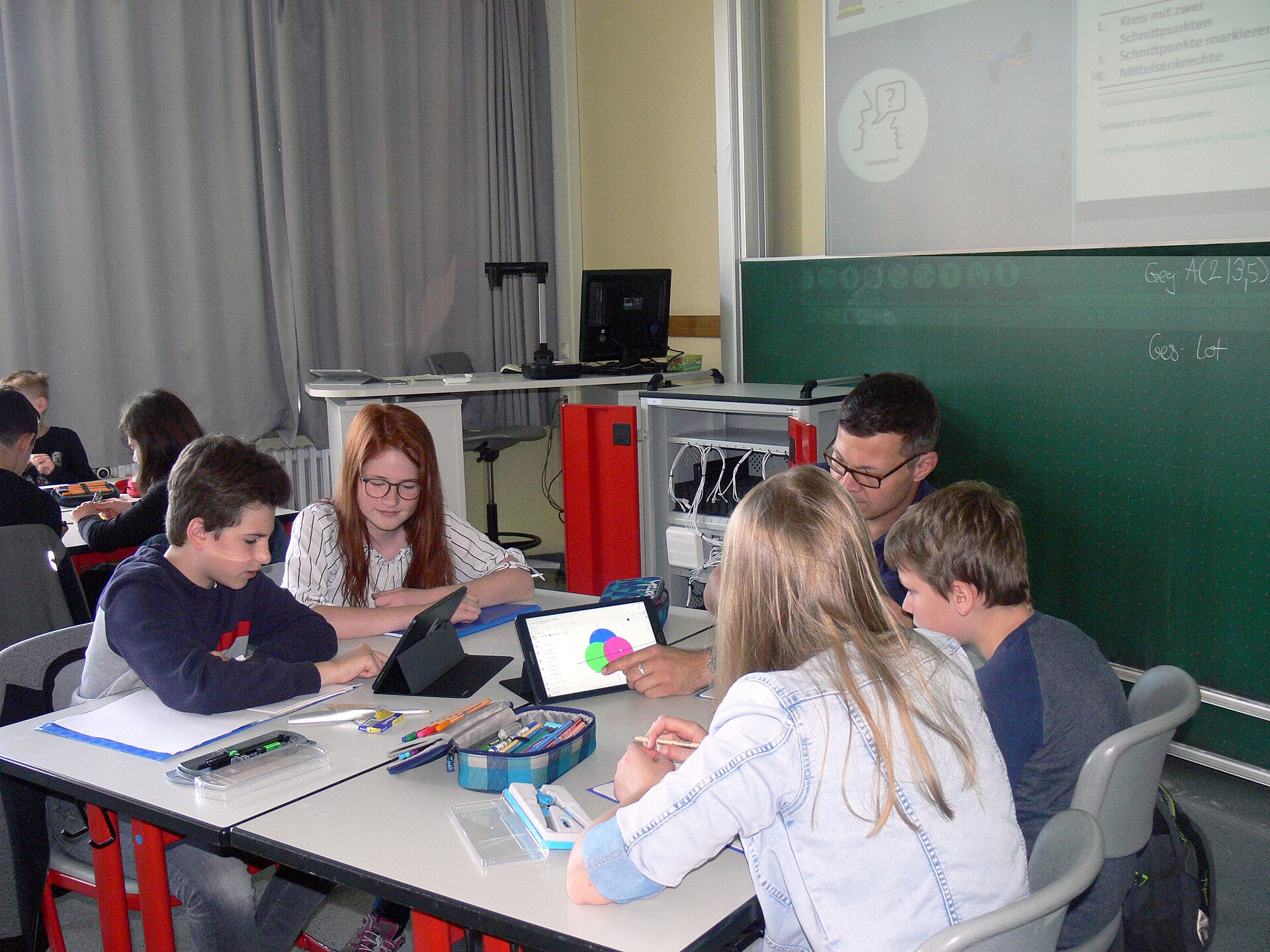 Students working together at a table.